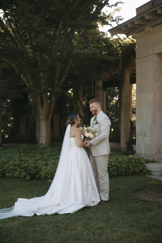 Documentary and editorial wedding photography from garden summer outdoor wedding at Eolia Mansion in Connecticut. Photos taken by Suz Lundeen Photo - destination wedding, family, and maternity photographer based in New England and the Midwest. Photo of bride and groom chatting before their ceremony.