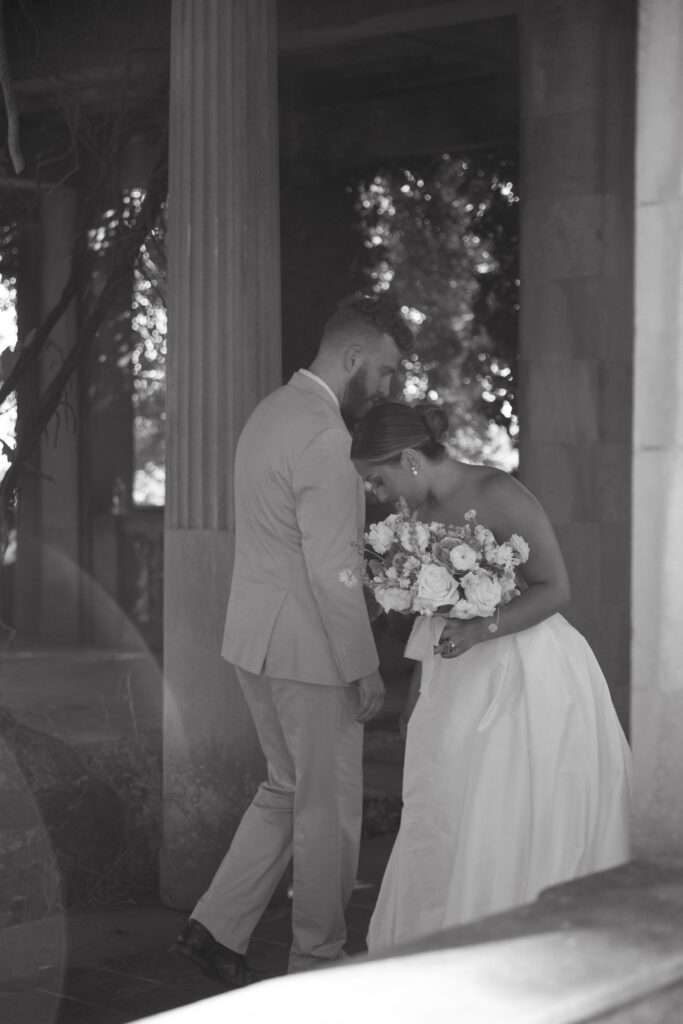 Documentary and editorial wedding photography from garden summer outdoor wedding at Eolia Mansion in Connecticut. Photos taken by Suz Lundeen Photo - destination wedding, family, and maternity photographer based in New England and the Midwest. Candid in between moment of bride and groom in black and white.