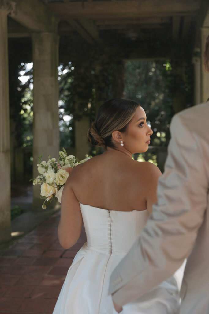 Documentary and editorial wedding photography from garden summer outdoor wedding at Eolia Mansion in Connecticut. Photos taken by Suz Lundeen Photo - destination wedding, family, and maternity photographer based in New England and the Midwest. Candid photo of bride.