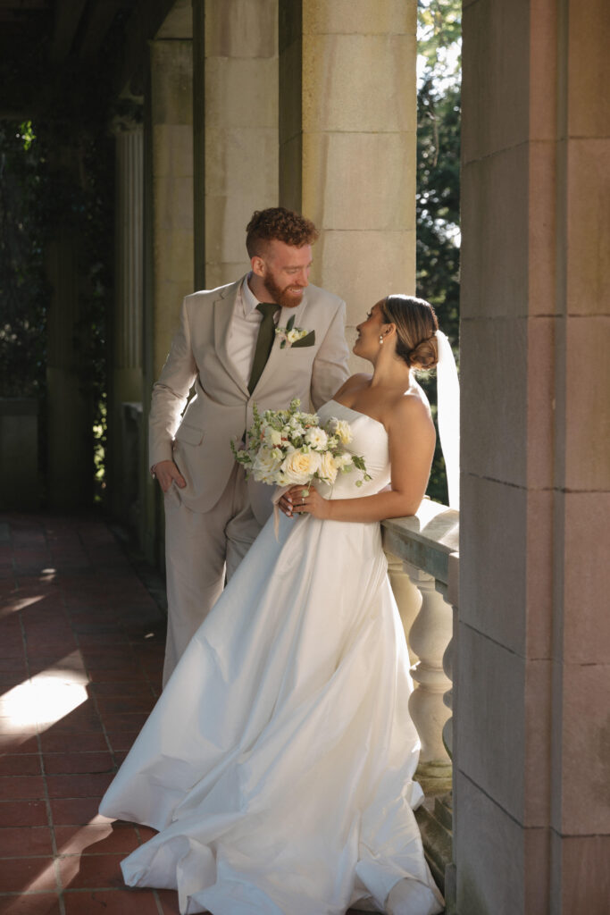 Documentary and editorial wedding photography from garden summer outdoor wedding at Eolia Mansion in Connecticut. Photos taken by Suz Lundeen Photo - destination wedding, family, and maternity photographer based in New England and the Midwest. Posed photo of bride and groom.