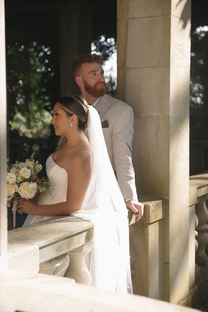 Documentary and editorial wedding photography from garden summer outdoor wedding at Eolia Mansion in Connecticut. Photos taken by Suz Lundeen Photo - destination wedding, family, and maternity photographer based in New England and the Midwest. Posed couples photo of bride and groom at their renaissance revival inspired wedding venue.